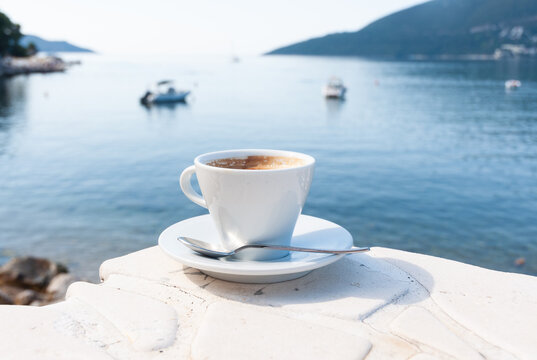 A cup of coffee on the stone above the sea in Herceg Novi.