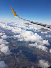 View from airplane window in a cloudy day