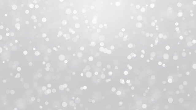 Silver festive animated background with falling bokeh light snow particles.