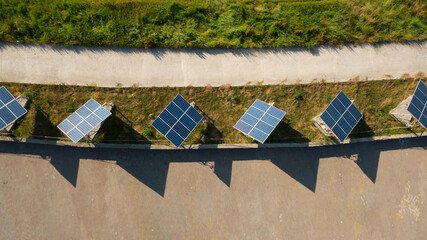 Solar pannels on the ground. Renewable energy and ecology. Green energy. Aerial drone view.