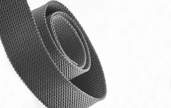gray coarse textured nylon fabric belt roll with copy space or negative space