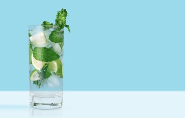 Tasty fresh Ice and mojito in a glass on the table
