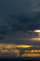 smoke from the chimney of a nuclear power plant at sunset