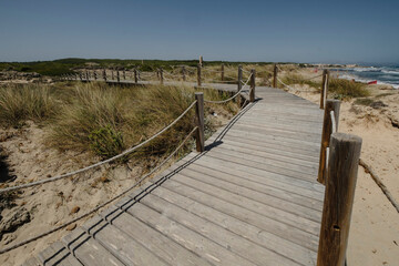 Fototapeta na wymiar pasarelas de madera sobre las dunas, Son Serra de Marina ,Mallorca, balearic islands, Spain