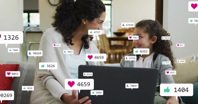 Animation of icons with growing number over biracial woman and her daughter using laptop