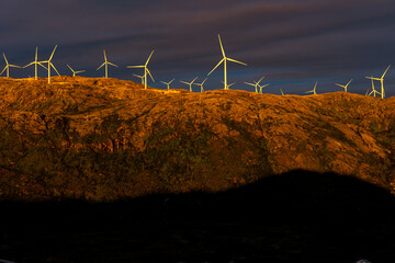 wind turbines illuminated by the midnight sun at Sommaroy (Sommarøy), Tromso Norway
