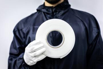 worker keep foam masking type in hand