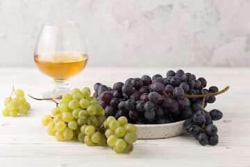 fresh juicy grapes in wineglass