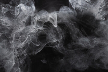 White steam on a black background.
