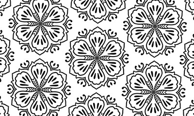 Black and white circle flower pattern in vintage mandala style for tattoos, fabrics or decorations and more	