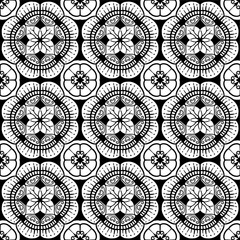 seamless pattern black and white  flower pattern in vintage mandala style for tattoos, fabrics or decorations and more.