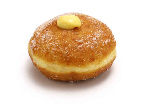 homemade Bomboloni filled with custard, Italian stuffed donuts.