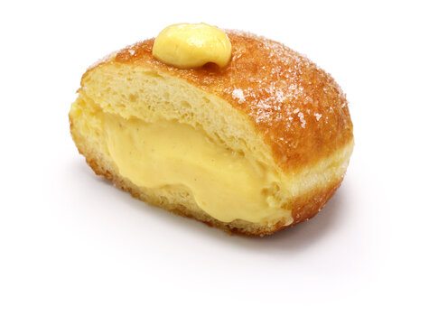 homemade Bomboloni filled with custard, Italian stuffed donuts.