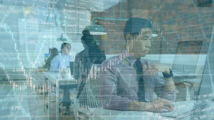 Animation of bar graph over asian employee working on computer with colleagues in office