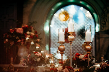 Fototapeta na wymiar Candles, lights and silver metal Wedding Decorations