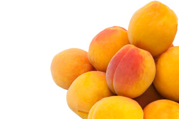 Beautiful apricots on a white texture. Isolated ripe peaches. Juicy white plums on a light background. Fruit growing concept.