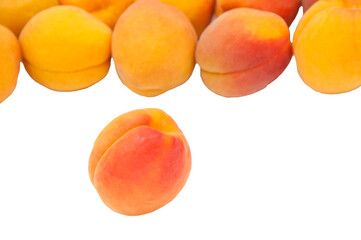 Beautiful apricots on a white texture. Isolated ripe peaches. Juicy white plums on a light background. Fruit growing concept.