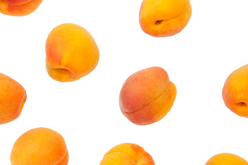 Beautiful apricots on a white texture. Isolated ripe peaches. Juicy white plums on a light background. Fruit growing concept.