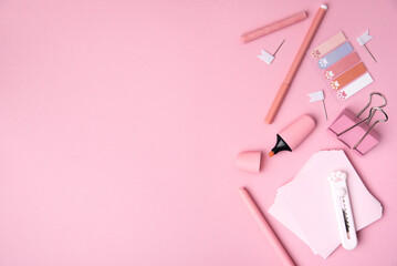 The concept of Back to school. School stationery on a pink background. Selective focus. background