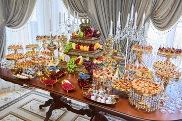 Sweet table candy bar on a holiday in honor of a wedding or children 's holiday.