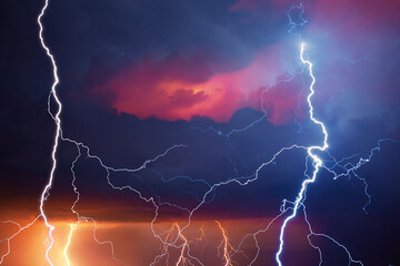 Fork lightning striking down during summer storm