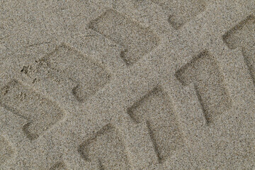 trace of a car on the beach