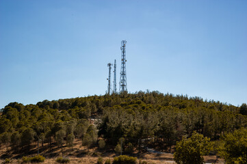 radio tower built on top of the hill. telecommunications tower and radiation