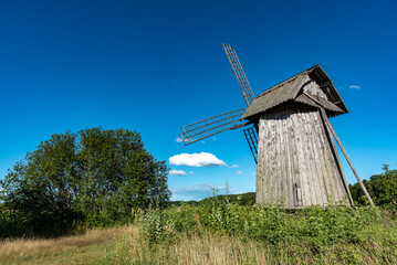 Fototapeta na wymiar old windmill on a hill