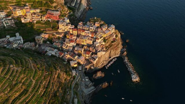 View from above, stunning aerial view of Manarola, the second village of the Cinque Terre coming from La Spezia. Manarola is the most picturesque village, made up of colorful tower-houses.