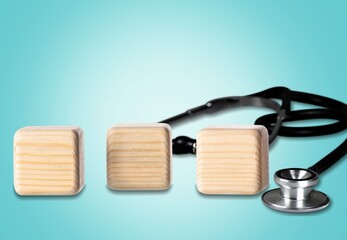 Wooden blocks on the desk. Scientific symbols of the coronavirus evolved from the omicron. The concept of the spread of new mutations of the virus in 2022