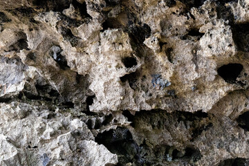 rocks near the beach with a great variety of veins of different colors and minerals, live and natural colored rocks