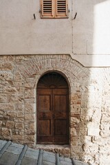 Fototapeta na wymiar wood door in a stone wall