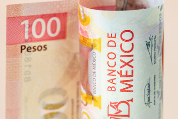 Mexico money, Rolled up 100 pesos banknote, Economic and business concept