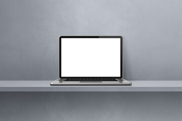 Laptop computer on grey shelf background