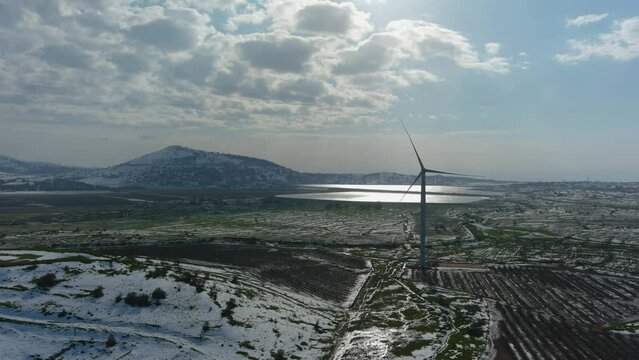 Golan Heights in the snow with windmill, Aerial
Drone view from North Israel Golan Heights, 2022
