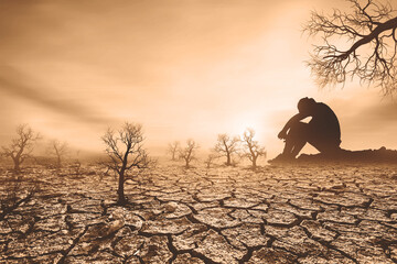 concept of global warming and drought People sat mourning over the drought. A world without water...