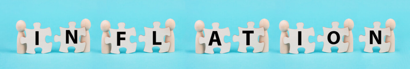 Men holding the letters for the word inflation, financial crash, economy development and increasing...