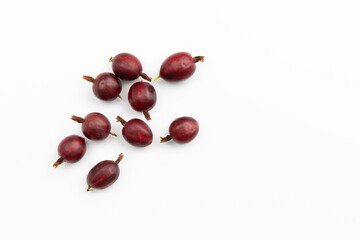 Obraz premium pile of fresh red gooseberry isolated on white, top view
