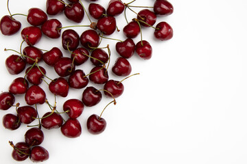 pile of cherries isolated on white background, top view