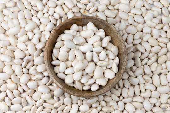 background of white kidney beans close up, top view