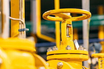 Pressure meters on natural gas yellow pipeline red valves. Concept industry power plant background