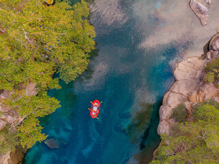 Rafting on red boat on blue river Turkey, aerial top view. Concept adventure extreme travel - obrazy, fototapety, plakaty