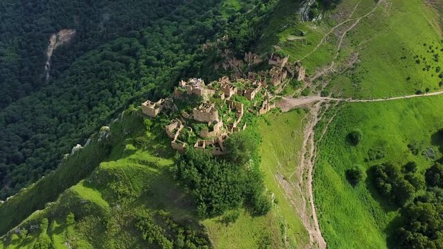 Aerial panorama view of abandoned aul Gamsutl in mountains. Orbit reveal