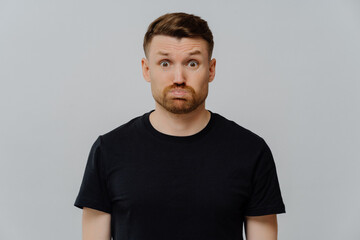 Young dissatisfied guy with dissatisfied face expression