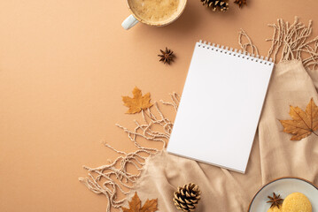 Autumn concept. Top view photo of notepad cup of coffee saucer with cookies anise yellow maple leaves plaid and pine cones on isolated beige background with copyspace