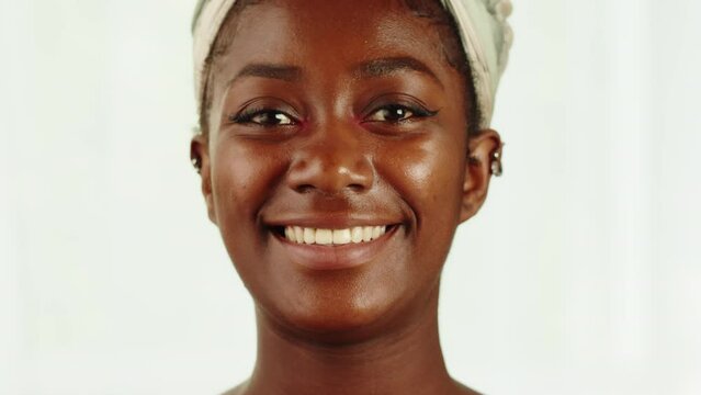 Happy native African American woman portrait. Young female student smiling close-up. Model posing, looking at camera with wide smile. 