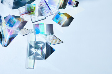 Geometric figures prisms with light diffraction of spectrum colors and reflection with trendy light