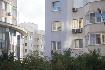 Full-color horizontal photo. Linear geometric composition. An inanimate landscape of parts of the facades of city buildings.