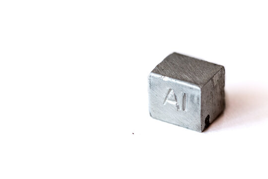 Aluminium cube with element name Al on it on white background