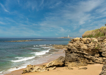 Cape Trafalgar as seen from Ca?os de Meca, southern Spain. Cloudy sky, turquoise sea, vacation,...